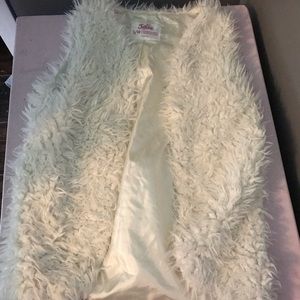 White fur vest